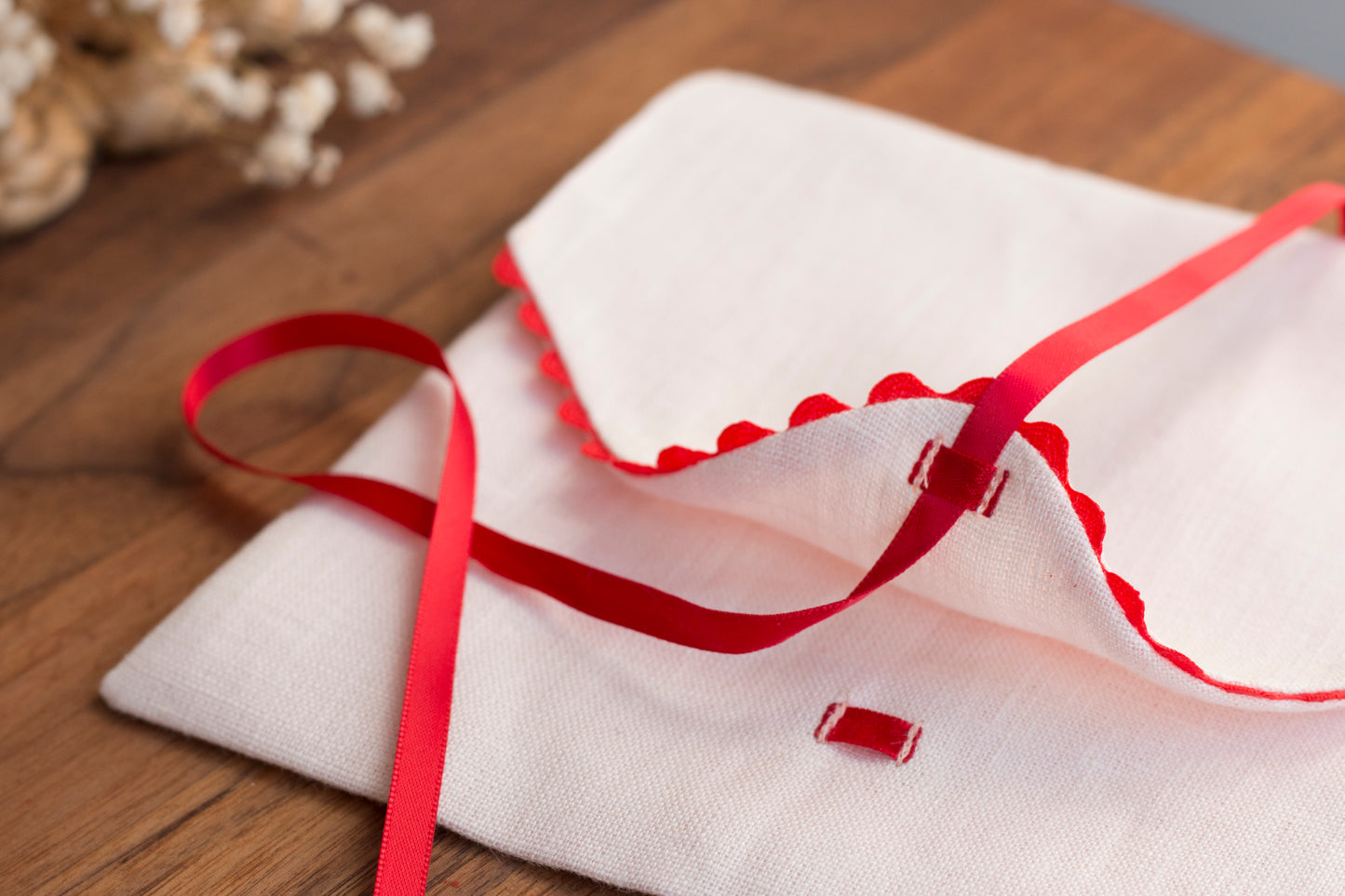 Pink linen envelope with red trim for Gifting